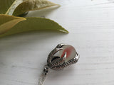 Red Cats Eye Sea Glass Marble - Dragon Claw Pendant