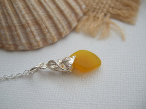yellow sea glass pendant with flower design setting