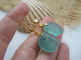gold earrings with heart design and aqua sea glass