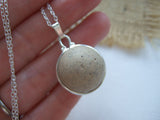clay marble from the beach set in silver plated band