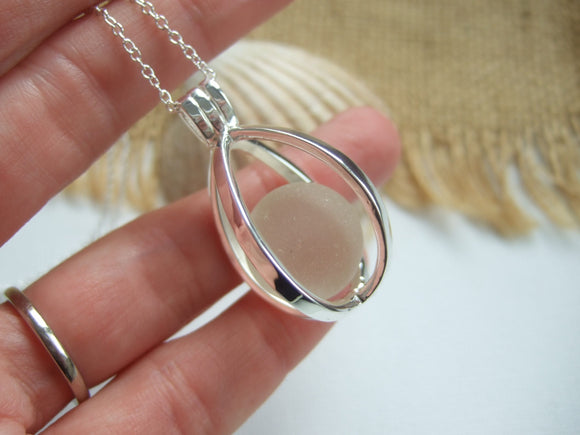 white sea glass marble in locket