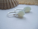 wave design earrings with opaque sea glass