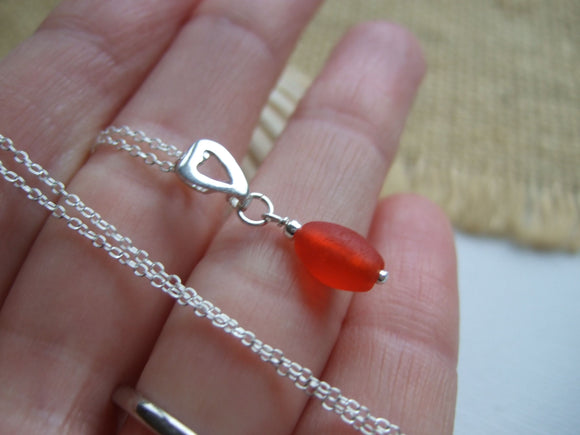 red sea glass bead with heart setting necklace